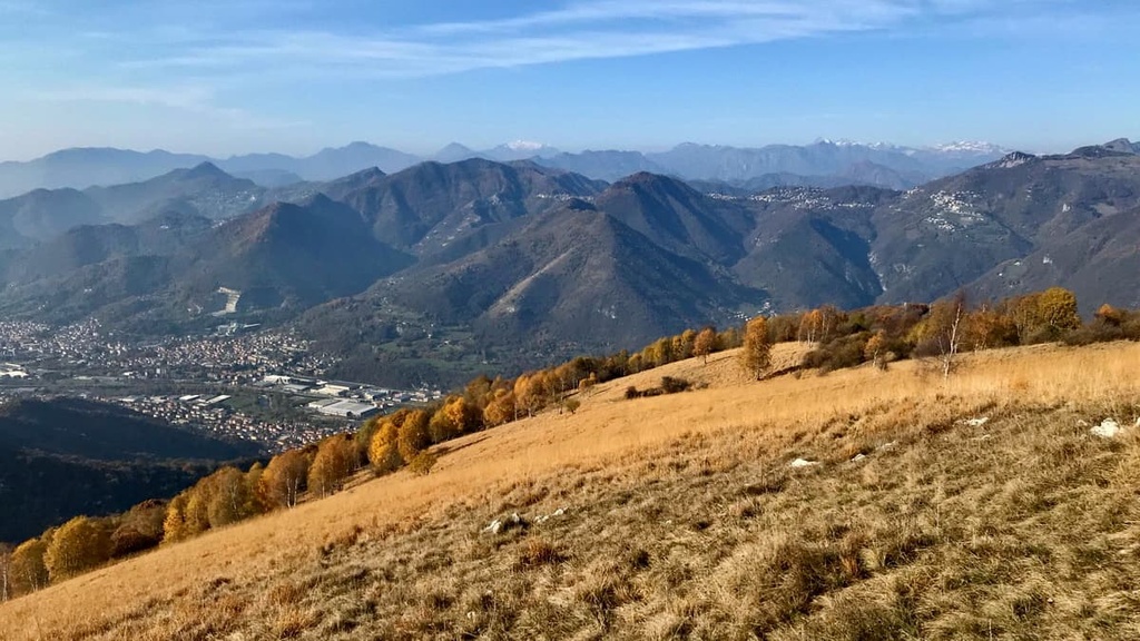View from Monte Misma on Seriana Valley, Bergamo and Monte Resegone in the late autumn, Bergamasque Alps, Italy
