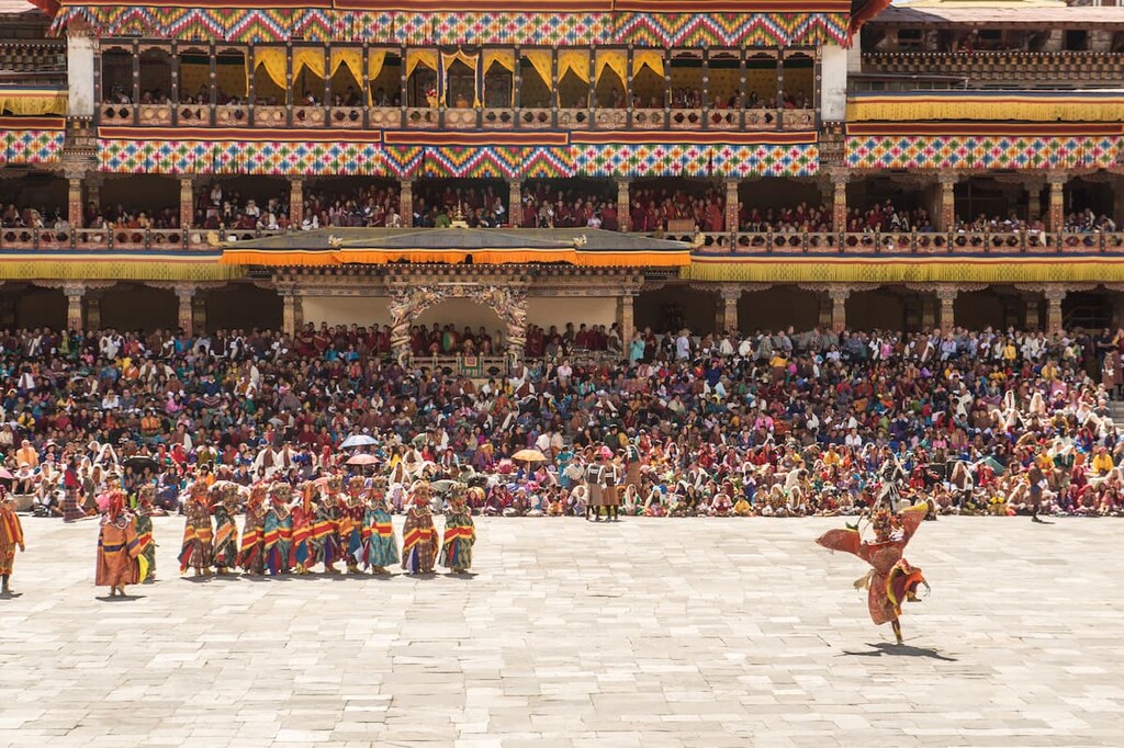 Costumed monk performs traditional dance in Tsechu festival at Tashichho Dzong Thimphu Bhutan, Bhutan