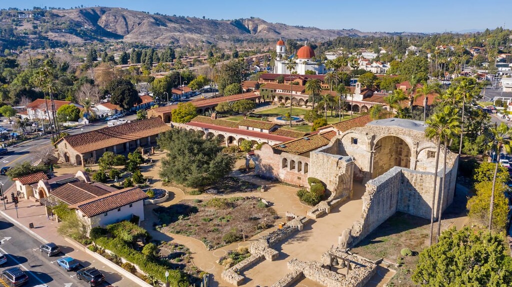 Spanish Colonial era mission and surrounding city of downtown San Juan Capistrano, California