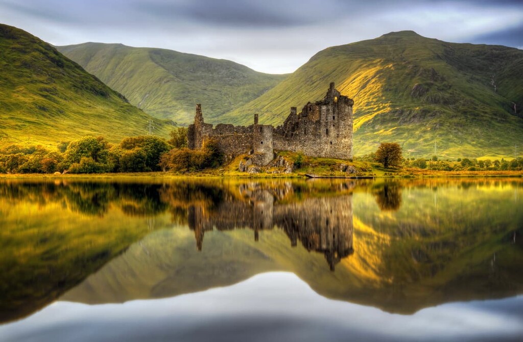 Kilchurn Castle reflection in Loch Awe at sunrise, Highlands, Highland, Scotland
