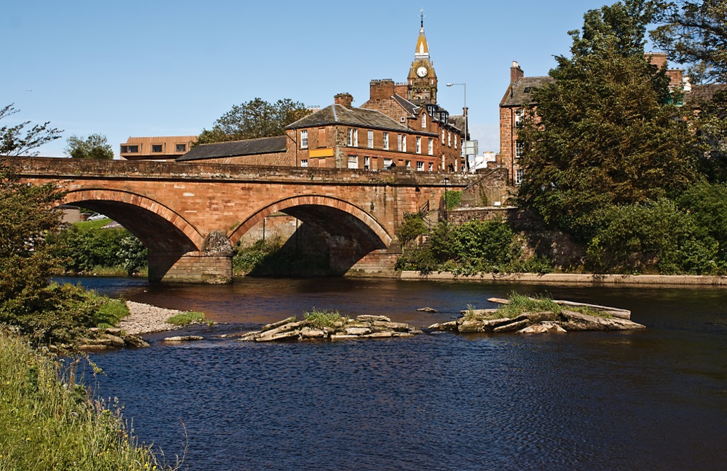 The Annan River with Annan Town Hall in the background. Dumfries and Galloway