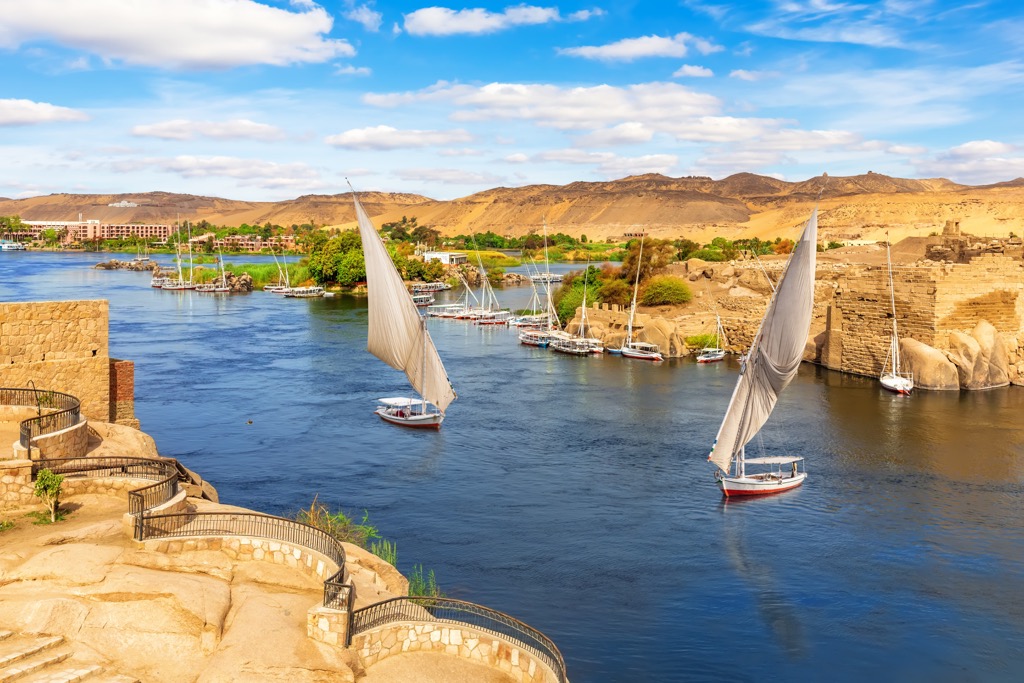 Nile river scenery and traditional sailboats, Aswan, Egypt