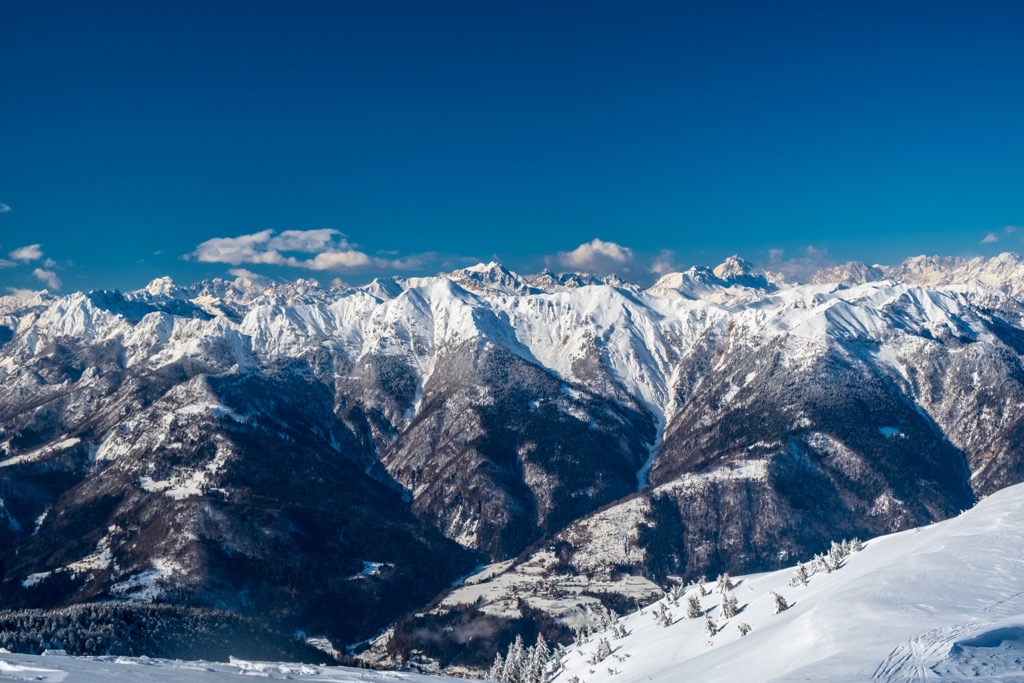 The view from the snow-capped summit Monte Zoncolan