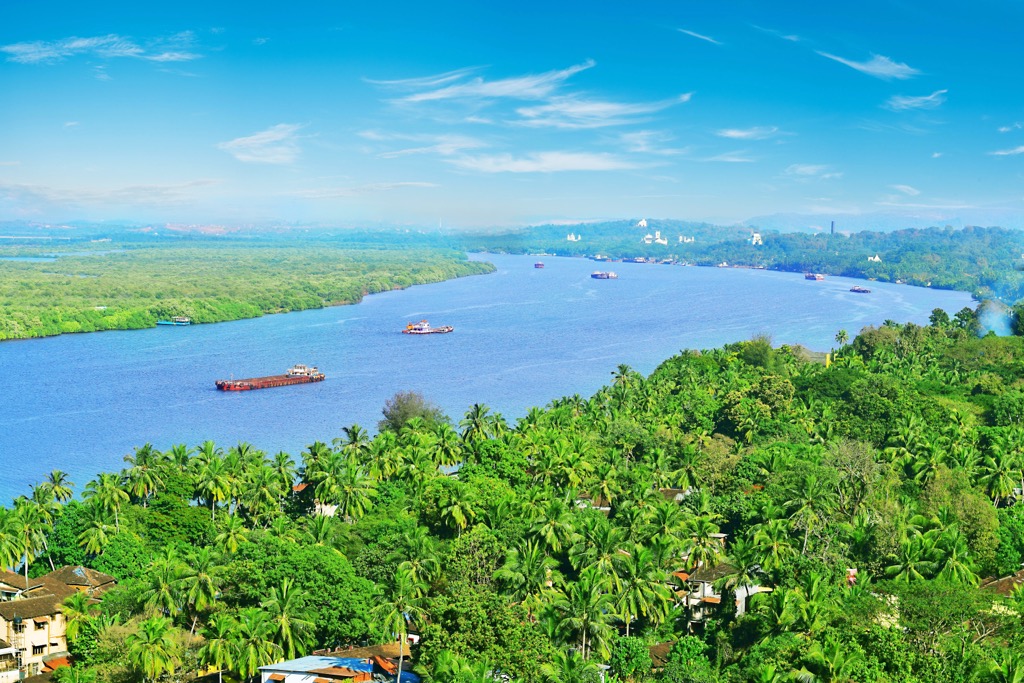 Mandovi river and Divar Island, Panjim City in Goa, India. Goa Mountains