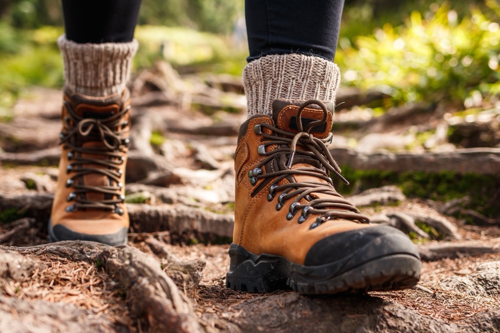 Boots trample shoes in the Alps. Hiking Season