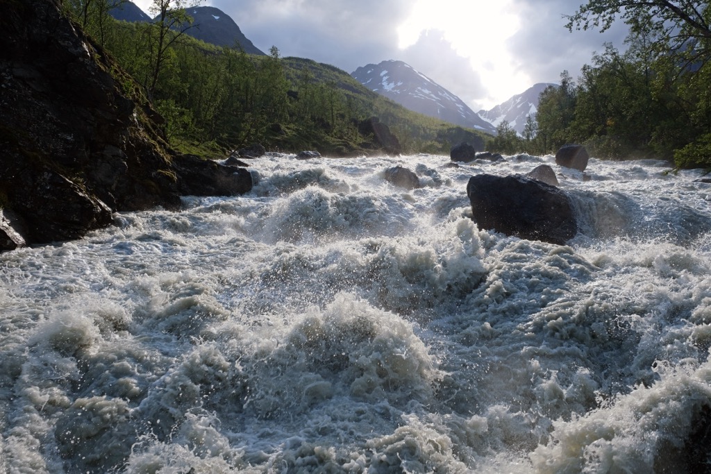 The wild Lyngsdalselva River in Furuflaten. Lyngen Alps