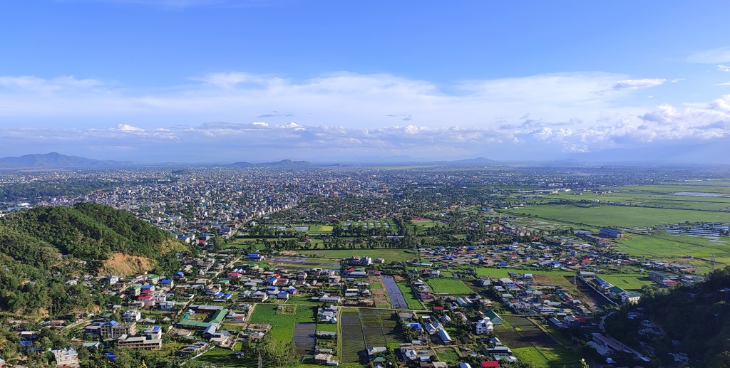 The city of Imphal sprawls across the vast Imphal Valley. Manipur Mountains