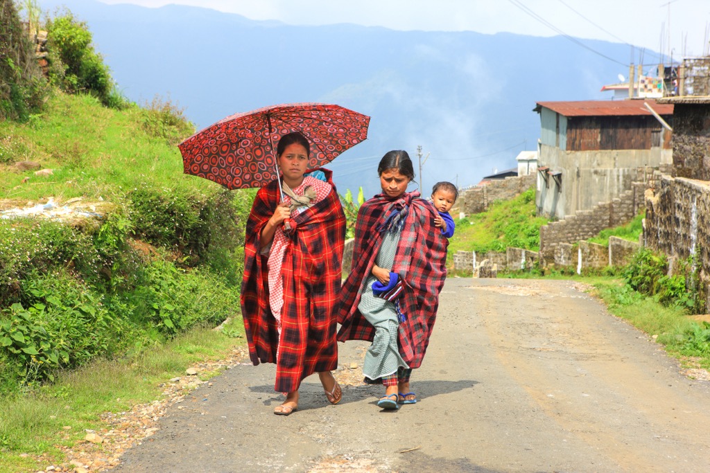 In places like Sohra, an umbrella comes in handy for both sun protection and frequent rain showers