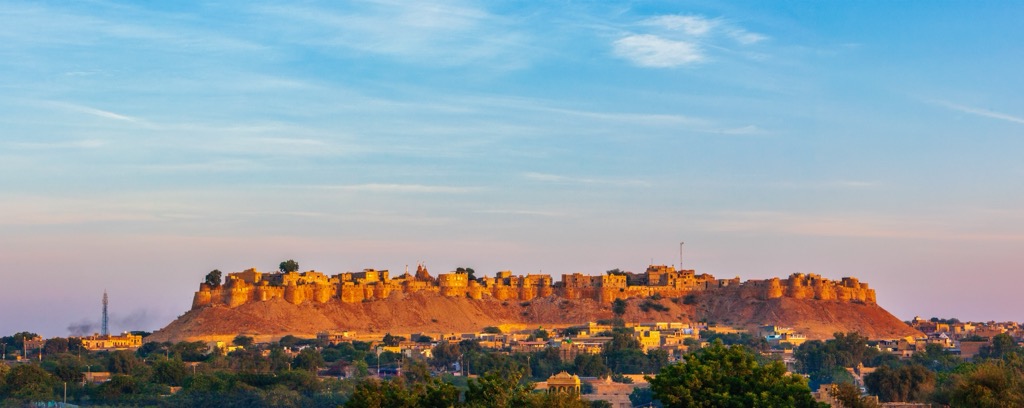 Jaisalmer’s iconic sandstone fortress in the desert. Geography