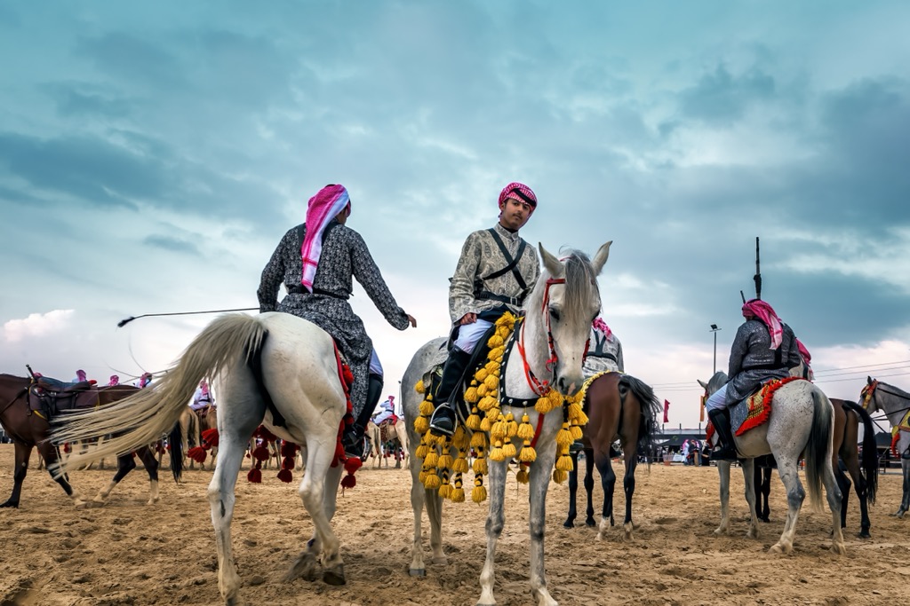 Saudi Arabia, Saudi Arab Horse rider on traditional desert safari festival 