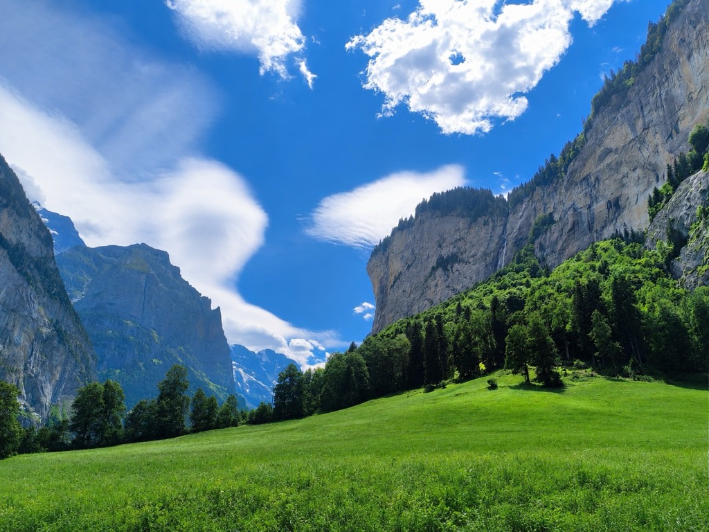 The Lauterbrunnen Valley, with meadows beneath sheer limestone cliffs