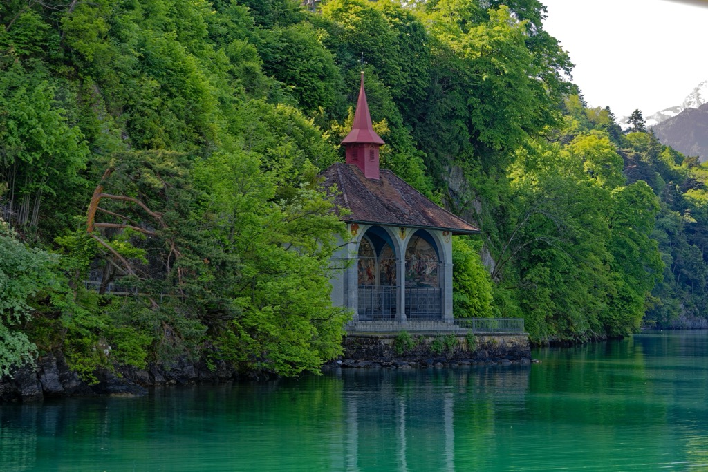 Tellskapelle on the steep Lake Uri shore beneath wooded mountains