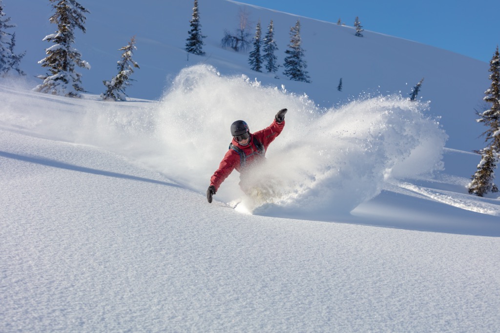 Snowboarding in deep powder. Should I Ski or Snowboard?