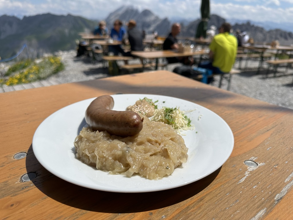 Sausages for lunch at the Totalphütte. Photo: Denis Bulichenko. Climbing Schesaplana
