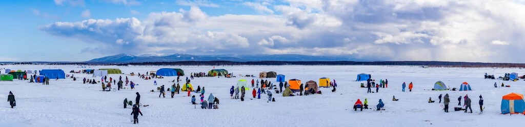 Competition of fishermen in winter on the Naiba river, Sakhalin Region, Russia